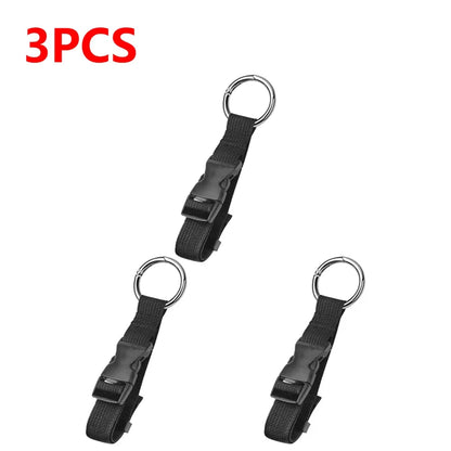 Three black keychains with metal rings on a white background