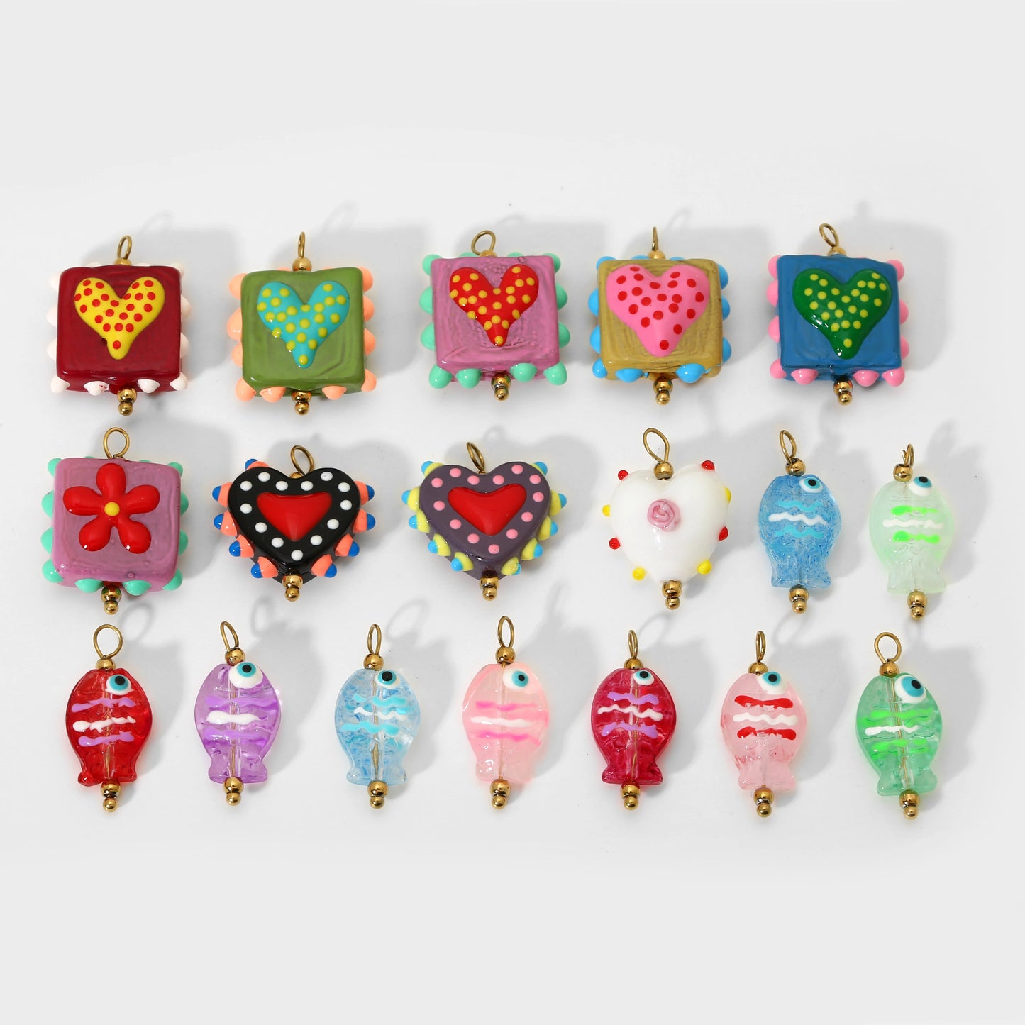 Colorful heart-shaped keychains on a white background