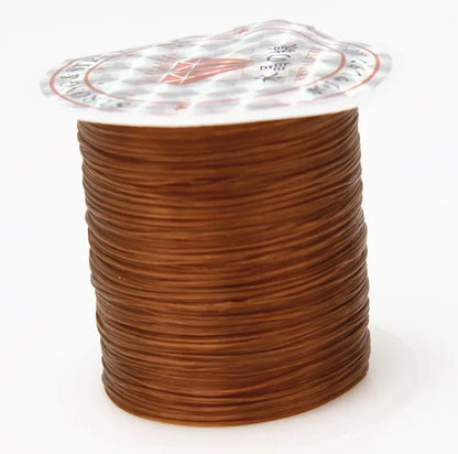 Spool of brown wire with a clear plastic cover on a white background