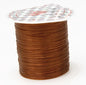 Spool of brown wire with a clear plastic cover on a white background