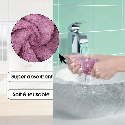 Purple scrubber being used to clean a sink with text indicating 'Super absorbent' and 'Soft & reusable'.