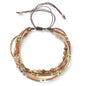Multistrand beaded bracelet with brown cord on a white background