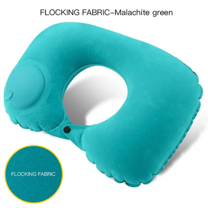 Turquoise inflatable neck pillow with malachite green flocking fabric on a white background.