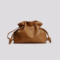 Brown leather drawstring bag on a light gray background