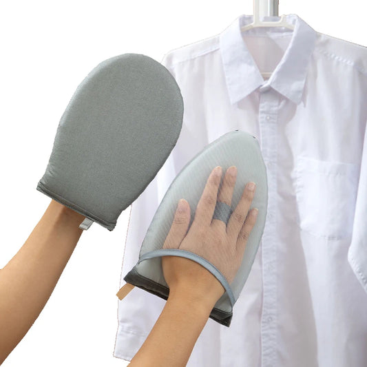 Gray cleaning mitts being used on a white shirt