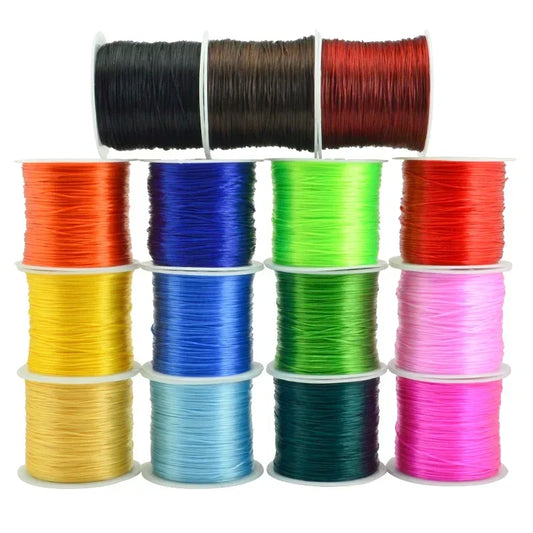 Assorted spools of colorful thread on a white background