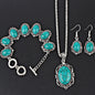 Jewelry set with turquoise stones and silver accents on a black background