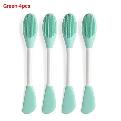 Four green silicone spoons on a white background