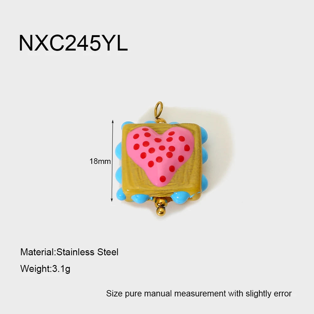 Heart-shaped pendant with measurements and material details on a white background