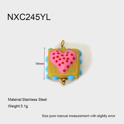 Heart-shaped pendant with measurements and material details on a white background