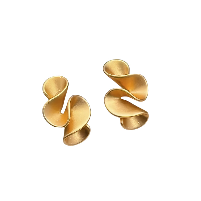 Gold spiral earrings on a jewelry display box