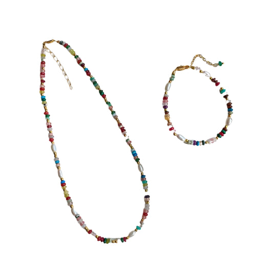 Colorful beaded necklace and bracelet on a Felin Style branded card.