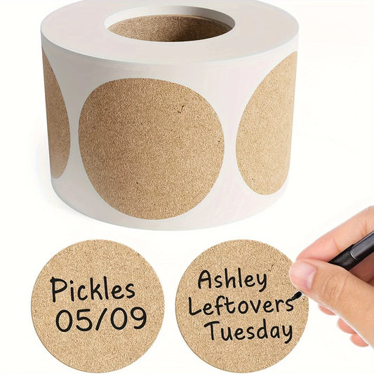 Roll of round brown labels with handwritten text and a hand holding a marker.