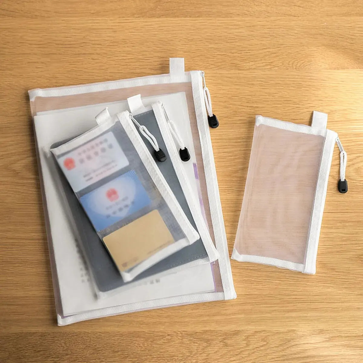 Set of photo sleeves with clear front and beige back on a wooden surface