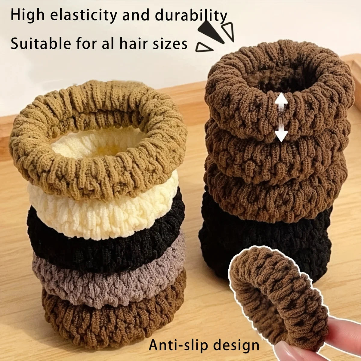Stack of brown, beige, black, and gray scrunchies on a wooden surface with text highlighting features.