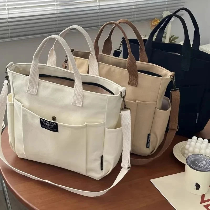 Four bags in different colors on a table with a blurred background