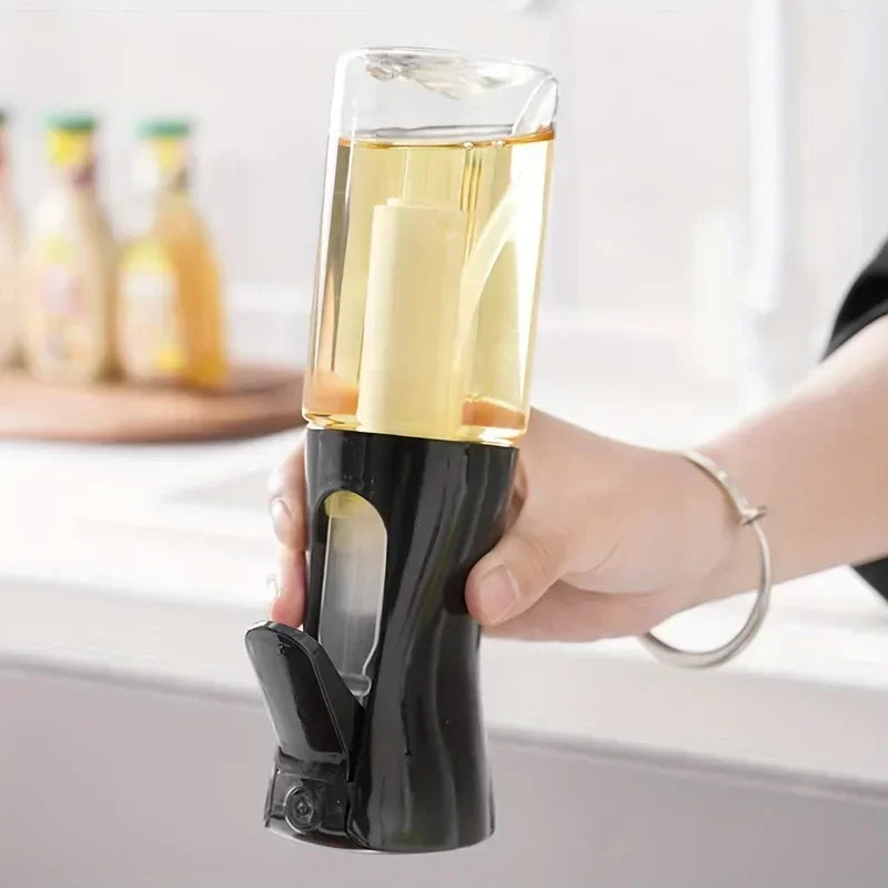 Hand holding an olive oil dispenser with oil dripping, kitchen setting in the background