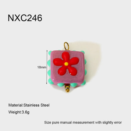 Small square pendant with a red flower design on a white background, featuring measurements and material details.