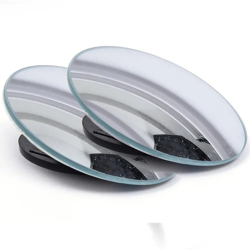Two glass plates with black rubber feet on a white background