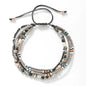 Multistrand beaded bracelet with various colored beads on a white background