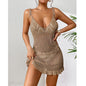 Woman wearing a beige crochet dress against a white background