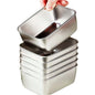 Stack of metal food containers with a hand lifting one, on a kitchen counter.