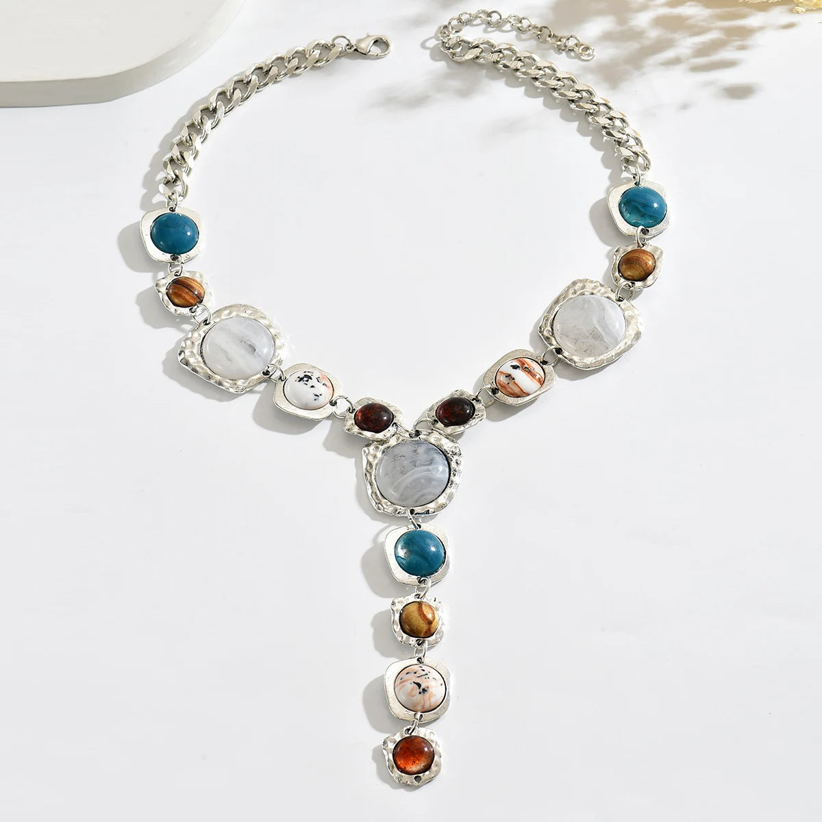 Necklace with multicolored stones on a white background