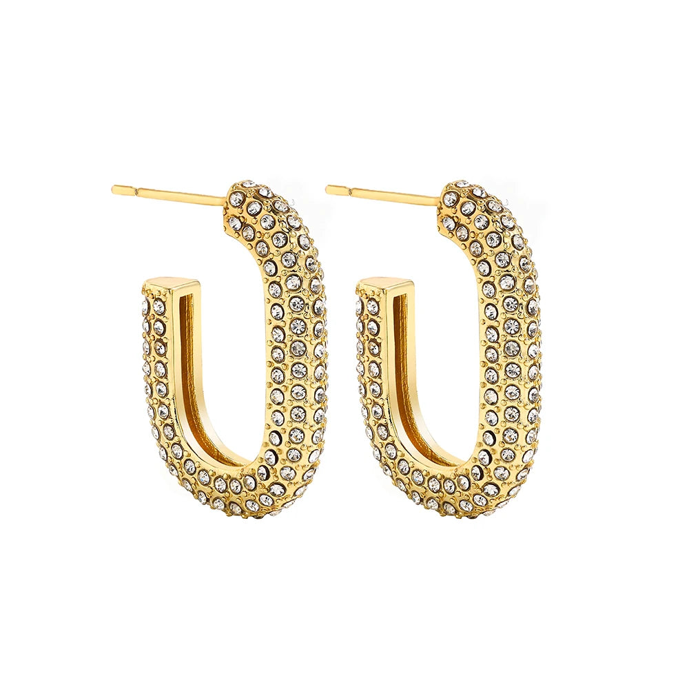 Gold hoop earrings with embedded stones on a white background