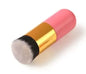 Makeup brush with pink handle and black bristle head on a white background