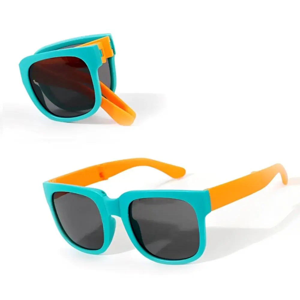 Sunglasses with turquoise frames and orange arms on a white background