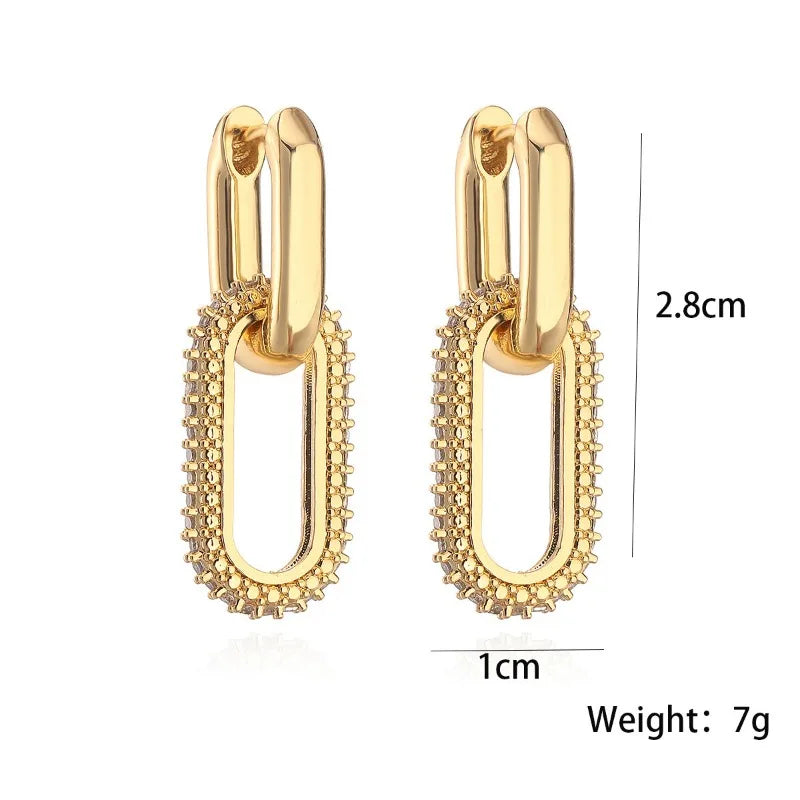 Gold hoop earrings with measurements and weight on a white background