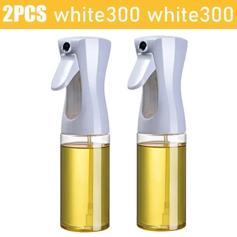 Two white spray bottles with yellow liquid on a white background