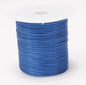 Roll of blue elastic band on a white background